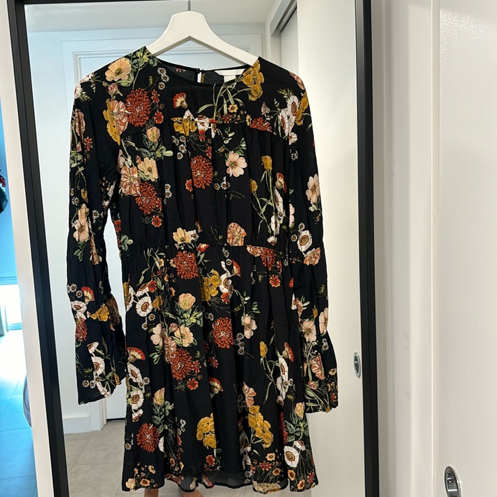 HM black mini dress with printed flower design